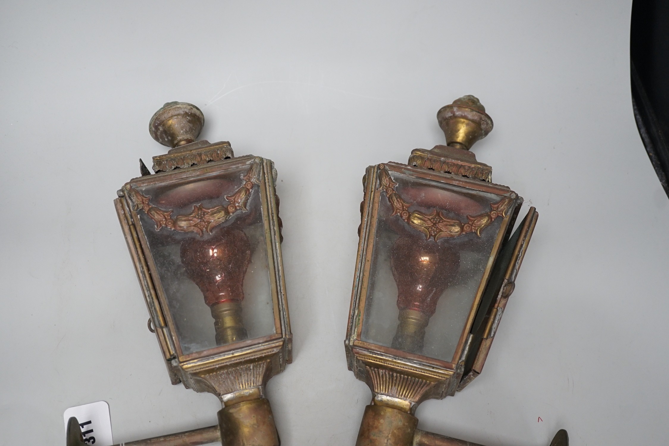 A pair of Victorian coaching lamps, converted to electricity, 51cm high